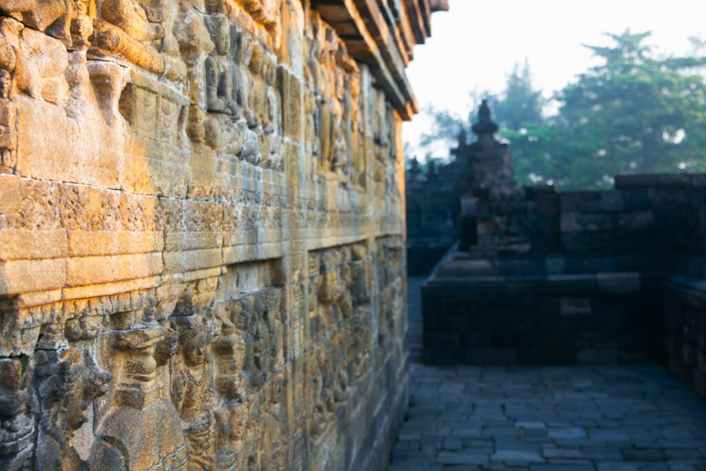 Carved stone reliefs at Borobudur temple