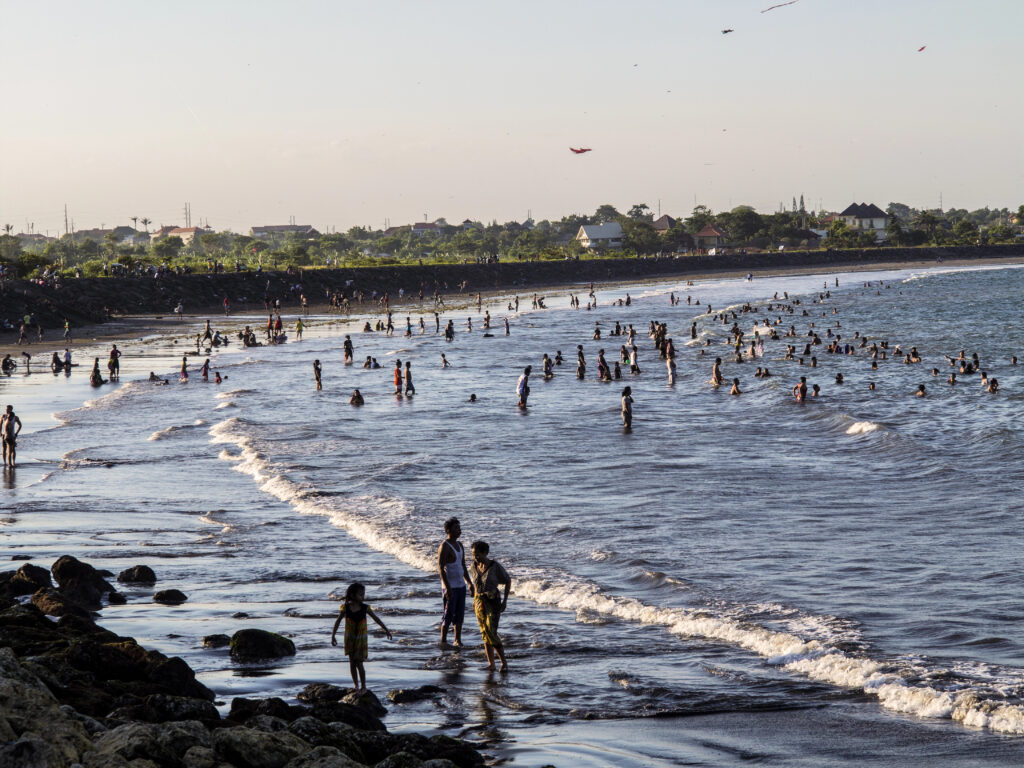 People swimming in Kuta Beach, Bali, Indonesia